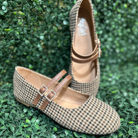 Featuring two sleek buckled straps across the foot, these stylish flats offer a secure fit and a touch of edge. The soft faux leather upper and lightly cushioned insole keep your feet comfy all day