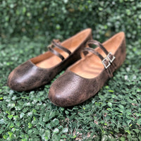 Featuring two sleek buckled straps across the foot, these stylish flats offer a secure fit and a touch of edge. The soft faux leather upper and lightly cushioned insole keep your feet comfy all day