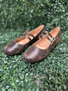 Featuring two sleek buckled straps across the foot, these stylish flats offer a secure fit and a touch of edge. The soft faux leather upper and lightly cushioned insole keep your feet comfy all day