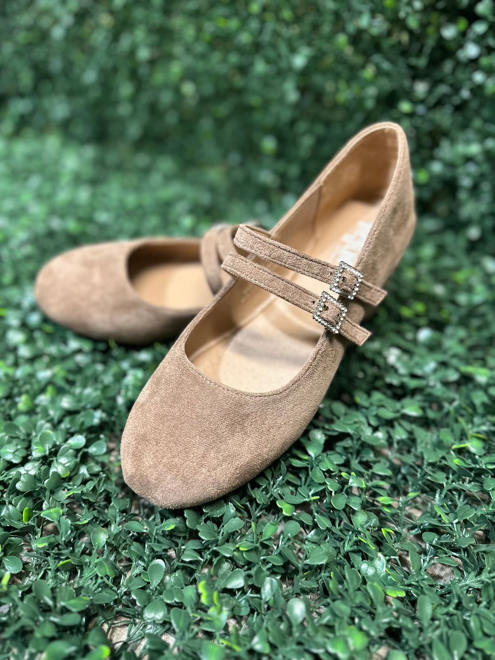 Featuring two sleek buckled straps across the foot, these stylish flats offer a secure fit and a touch of edge. The soft faux leather upper and lightly cushioned insole keep your feet comfy all day.