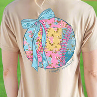 Simply Southern Tee
Baseball/Softball with bow 
patchwork flower detail on the ball 
printed on a tan color tee