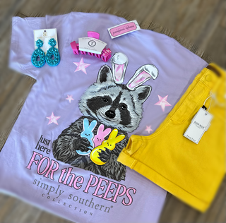 Simply Southern Tee 
Easter Tee
Short Sleeve Tee 
features a raccoon wearing bunny ears holding peeps. 
printed on a lilac tee