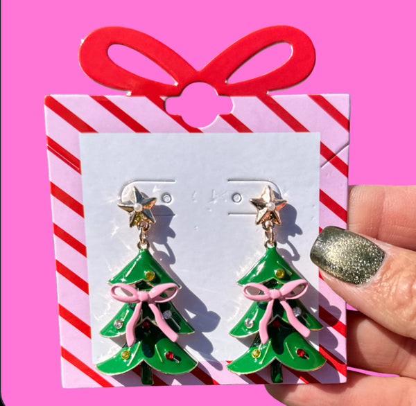 Add a festive touch to your holiday look with the Pink Bow Christmas Tree Earrings. These charming post-back earrings measure 2