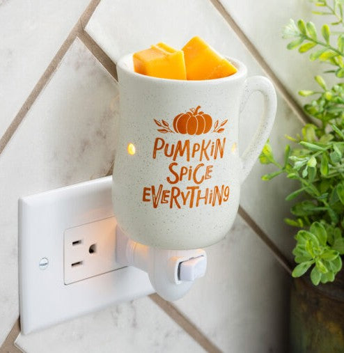 Pumpkin Spice Pluggable Fragrance Warmer shaped like a cozy mug. Perfect for small spaces—flameless, festive scent with rotating plug base and bulb included.