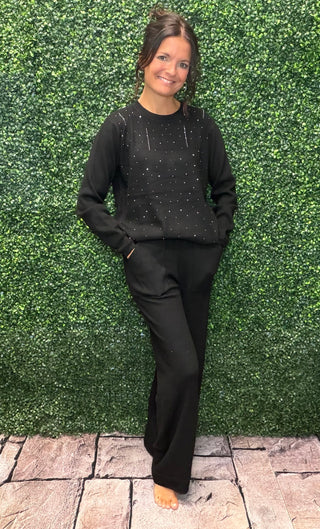 Color | Black
Detail | Rhinestone embellishment
Fabric | 50% Viscose, 20% Polyamide (Nylon), 30% PBT stretch knit
Fit | Relaxed; one size fits most (S–XL)
Finish | Soft, silky hand feel with natural drape; wrinkle-resistant
