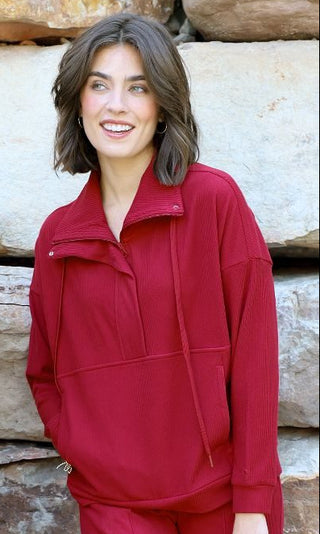 Color | Dark Red
Fabric Feel | Soft, textured ribbed knit
Fabric Content | 81% polyester, 19% spandex
Neckline | Half zip
Finishing Detail | Shimmer detail