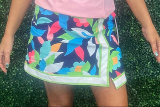 The skort that does it all. The Aryeh Shelby Skort in Tropical Nightfall brings together athletic-inspired style and all-day comfort in one effortless piece. Sleek contrast trim elevates the look while UPF sun-protective fabric keeps you shielded and cool — whether you're exploring a new city, hitting the resort pool deck, or running weekend errands.