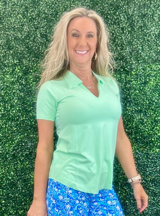 Elevate your wardrobe with the Lulu B Short Sleeve V-Neck Top with Collar, featuring butter-soft, wrinkle-free fabric that offers both luxury and practicality. This top is designed with UPF 50+ sun protection, making it a must-have for sunny days and travel. The added collar gives it a polished, sophisticated look, while the lightweight, breathable fabric ensures all-day comfort. Ideal for both casual outings and more dressed-up moments, this top packs neatly without wrinkles, so you can always look put tog