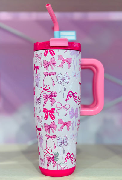 Pink and white tumbler with bow pattern. 40oz tumbler with handle and straw