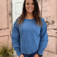 Simply Southern Amber Knit Top
Effortlessly chic and cozy, the Simply Southern Amber Knit Top is a must-have for everyday wear. Designed with an oversized silhouette, forward side seams, and a dropped hem for a flattering drape. Finished with a classic crew neckline and balloon sleeves with cuff detail for a soft, feminine touch.