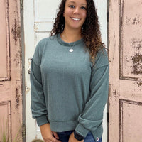 Simply Southern Amber Knit Top
Effortlessly chic and cozy, the Simply Southern Amber Knit Top is a must-have for everyday wear. Designed with an oversized silhouette, forward side seams, and a dropped hem for a flattering drape. Finished with a classic crew neckline and balloon sleeves with cuff detail for a soft, feminine touch.