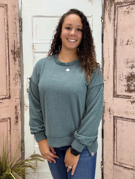 Simply Southern Amber Knit Top
Effortlessly chic and cozy, the Simply Southern Amber Knit Top is a must-have for everyday wear. Designed with an oversized silhouette, forward side seams, and a dropped hem for a flattering drape. Finished with a classic crew neckline and balloon sleeves with cuff detail for a soft, feminine touch.
