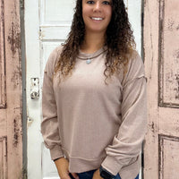 Simply Southern Amber Knit Top
Effortlessly chic and cozy, the Simply Southern Amber Knit Top is a must-have for everyday wear. Designed with an oversized silhouette, forward side seams, and a dropped hem for a flattering drape. Finished with a classic crew neckline and balloon sleeves with cuff detail for a soft, feminine touch.