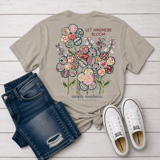 A beige graphic t-shirt featuring a colorful floral design with the text 'LET KINDNESS BLOOM' and 'simply southern collection'. Back of Tee design