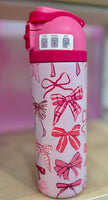 Pink water bottle with bow pattern

