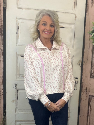 Cinched pullover top with snap collar neckline, dropped shoulders, long sleeves, and adjustable hem, women’s relaxed-fit casual pullover.