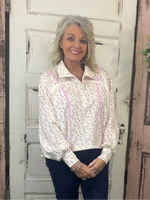 Cinched pullover top with snap collar neckline, dropped shoulders, long sleeves, and adjustable hem, women’s relaxed-fit casual pullover.
