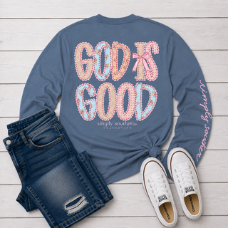 slate blue long-sleeve t-shirt with 'GOD IS GOOD' printed on the back in a pink and multicolor floral patchwork pattern. 