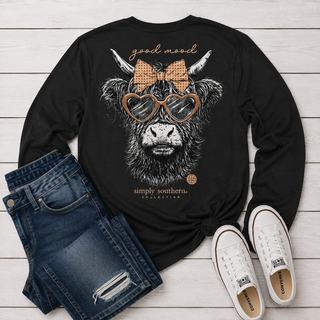 The shirt features a highland cow illustration with heart-shaped sunglasses, a checkered bow, and the text 'good mood' and 'simply southern collection'.