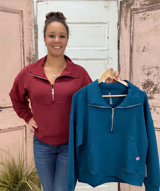 This half zip pullover features a crop fit, front kangaroo pocket, raglan sleeves, ribbed cuffs &amp; hem, large fold over collar with simply southern logo label. made of 48 modal, 48 polyester and 4 spandex.&nbsp;