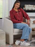 This half zip pullover features a crop fit, front kangaroo pocket, raglan sleeves, ribbed cuffs &amp; hem, large fold over collar with simply southern logo label. made of 48 modal, 48 polyester and 4 spandex.&nbsp;
