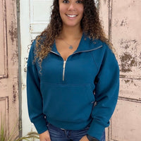 This half zip pullover features a crop fit, front kangaroo pocket, raglan sleeves, ribbed cuffs &amp; hem, large fold over collar with simply southern logo label. made of 48 modal, 48 polyester and 4 spandex.&nbsp;