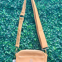 The Simply Southern Ibiza Crossbody blends style and function with PU leather, zip top closure, front pocket, and fully lined interior with card sleeves and zip pocket. Features detachable strap and Simply Southern logo.