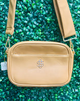 The Simply Southern Ibiza Crossbody blends style and function with PU leather, zip top closure, front pocket, and fully lined interior with card sleeves and zip pocket. Features detachable strap and Simply Southern logo.
