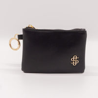 Perfect for on-the-go! This compact ID wallet holds cash, cards & keys with zip pockets, ID slot & gold key ring. Made of durable 100% polyester.