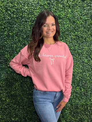 Simply Southern Embroidered Crew 
Design: Statement "Make Heaven Crowded" with a white bow under the statement. Embroidered across the front of the crew. 
Stitched on a pink crew sweatshirt 