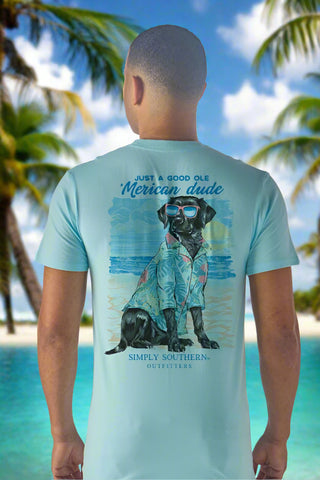 Simply Southern 
Mens Tee 
Printed on Aqua Tee 
features a dog wearing tropical shirt and sunglasses on the beach with the saying "just a good ole Merican dude"