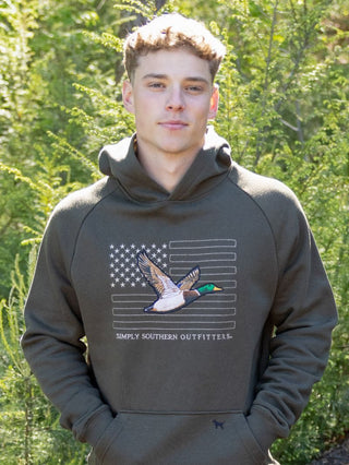 Built for the outdoors, made to turn heads. The Simply Southern Men's Outdoor Hoodie in Duck features a bold duck hunting print on heavyweight fleece with a camo-lined hood — rugged style with a patriotic, outdoorsy attitude he'll wear all season long.

Print | Duck hunting graphic
Hood | Camo-lined with adjustable drawcord
Fabric | 60% Cotton, 40% Polyester — heavyweight fleece, warm and durable
Brand | Simply Southern
