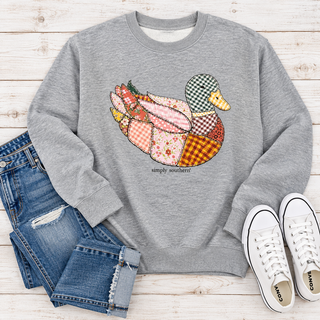 Brand | Simply Southern
Style | Long-sleeve crewneck sweatshirt
Color | Heather gray
Graphic | Large front duck design with a colorful mix of floral, gingham, and plaid patterns; Simply Southern lettering beneath
Finish | Ribbed neckline, cuffs, and hem
Fabric | See garment label for fiber content
Care | Follow the garment care label