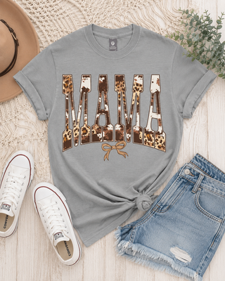 Simply Southern Short Sleeve Tee 
Printed on a driftwood color tee 
features a mama cow/leopard print design with a bow under it. 