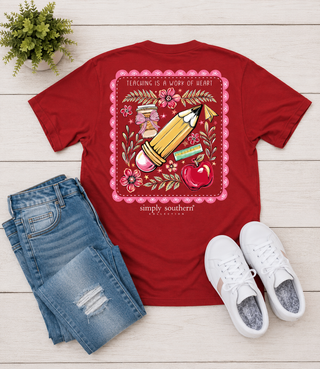 Brand | Simply Southern
Style | Short Sleeve Graphic Tee
Graphic | Pencil, apple, ruler, and florals with "Teaching Is a Work of Heart" saying
Frame Detail | Scalloped pink border
Color | Red
Neckline | Crew neck
Sleeve | Short sleeve
Fabric | 100% Cotton — soft, breathable, and easy to care for
Care | Machine wash cold, tumble dry low