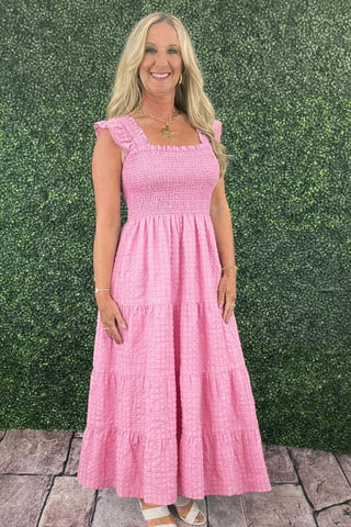 Effortlessly feminine and easy to wear, the Simply Southern Textured Maxi Dress is a go-to for warm-weather days and casual occasions. Designed with a soft textured fabric, this dress features a ruffle detail and a shirred bodice that offers a comfortable, flexible fit. The tiered skirt design adds beautiful movement and flow, while the maxi length creates a flattering, breezy silhouette. Lightweight and easy to style, this dress is perfect for everyday wear, vacations, or laid-back gatherings.
