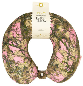 Travel pillow with pink and green camouflage pattern on a white background