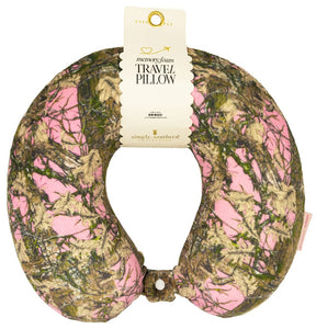 Travel pillow with pink and green camouflage pattern on a white background