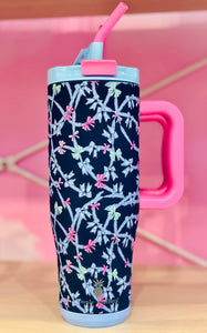 Navy blue tumbler with pink handle and bow pattern