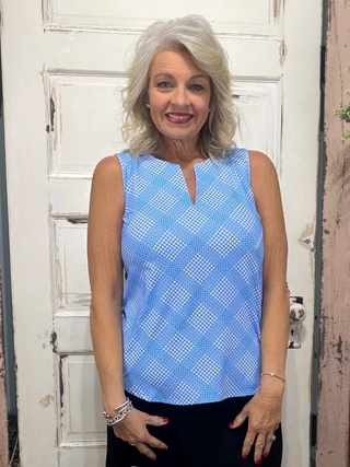 Crafted from 92% Nylon and 8% Span materials, this Sleeveless Key Hole Top boasts a stylish V neckline and a straight hemline for a flattering silhouette. Pre-shrunk for the perfect fit, it also offers UPF50 sun protection and measures 23 inches at the center. Machine wash and hang dry for easy maintenance.