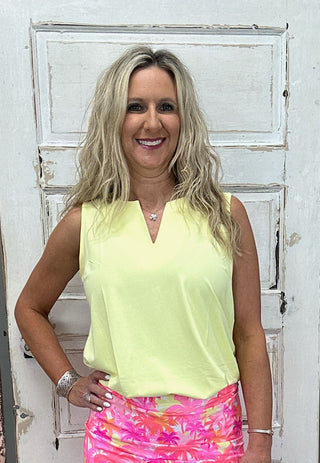 The Lulu-B Sleeveless Keyhole Top in Yellow is crafted from a soft, stretchy 92% Nylon / 8% Spandex blend in a warm, sunny yellow hue — a chic V-neckline with a keyhole detail and a straight hemline give it a flirty, polished finish that works just as well tucked into your favorite bottoms as it does worn on its own.