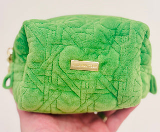 Peninsula Green quilted fabric and gold bamboo zipper pulls. The outside is stain-resistant and easy to clean so it will hold up trip after trip.