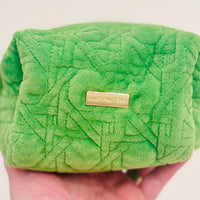 Peninsula Green quilted fabric and gold bamboo zipper pulls. The outside is stain-resistant and easy to clean so it will hold up trip after trip.