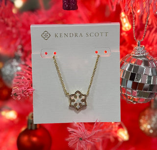 Evoke the wonder and joy of the first snowfall of the season with the Snowflake Gold Short Pendant Necklace in White Kyocera Opal. Crafted with shimmering white Kyocera opal to mimic the brilliant sparkle of snow, this pendant is bound to be a favorite this holiday season.