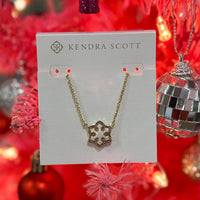 Evoke the wonder and joy of the first snowfall of the season with the Snowflake Gold Short Pendant Necklace in White Kyocera Opal. Crafted with shimmering white Kyocera opal to mimic the brilliant sparkle of snow, this pendant is bound to be a favorite this holiday season.