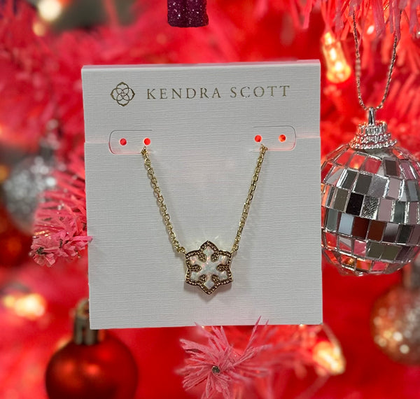 Evoke the wonder and joy of the first snowfall of the season with the Snowflake Gold Short Pendant Necklace in White Kyocera Opal. Crafted with shimmering white Kyocera opal to mimic the brilliant sparkle of snow, this pendant is bound to be a favorite this holiday season.