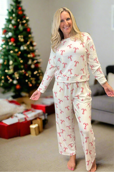 Festive Candy Cane Print – Perfect for Christmas mornings
 Relaxed Fit Crew Neck Top – Soft and breathable
Straight Leg Pants with Elastic Waistband & Drawstring – Adjustable comfort
Elastic Cuffs at Ankle – Stay-in-place fit for cozy wear
Inseam: 27