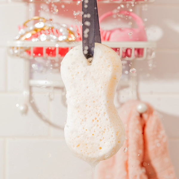 Indulge in the obsession-worthy scent of Sweet Grace while you cleanse, exfoliate, and hydrate your skin. Our luxurious bath sponge doubles as a gentle body buffer, creating a rich, creamy lather with just a little water and a squeeze. Pamper yourself with this simple self-care essential and enjoy the captivating fragrance of Sweet Grace all day long.

How to Use:
Wet sponge under warm running water and gently squeeze to form a creamy lather.
Massage over wet skin in a circular motion to leave you smelling 