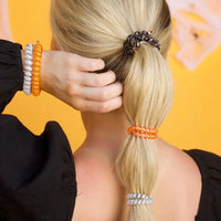 Hold your hair and enhance your style with TELETIES. The strong grip, no rip hair tie that doubles as a bracelet. Strong, pretty and stylish, TELETIES are designed to withstand everyday demands while taking your look to the next level

This five pack includes 3 smalls and 2 larges.