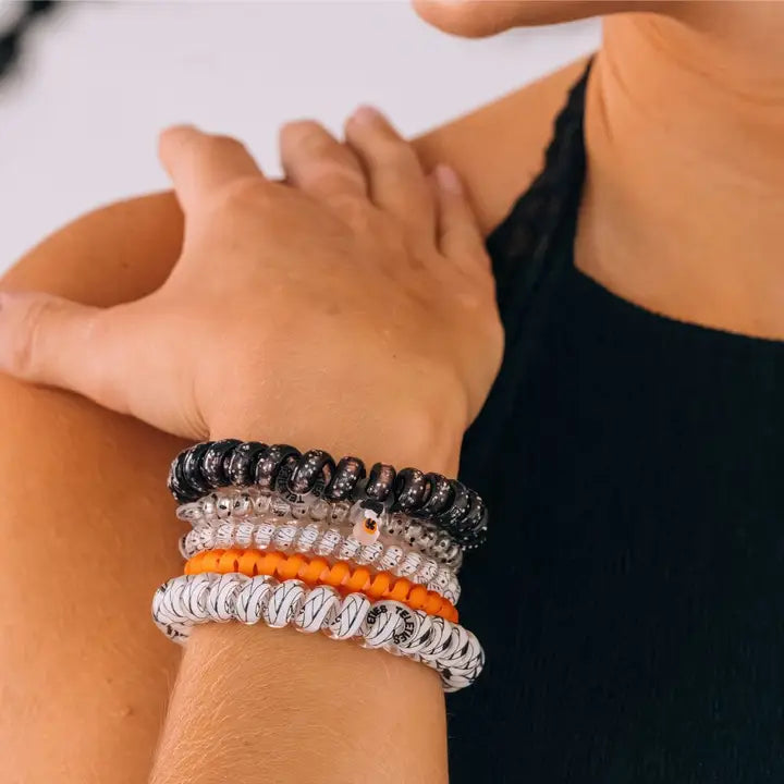 Hold your hair and enhance your style with TELETIES. The strong grip, no rip hair tie that doubles as a bracelet. Strong, pretty and stylish, TELETIES are designed to withstand everyday demands while taking your look to the next level

This five pack includes 3 smalls and 2 larges.